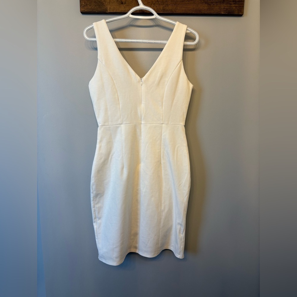 White Asymmetrical Mini Dress with a deep v neckline in size Medium - Picture 6 of 8
